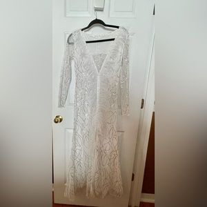 Feathered trimmed sequined gown